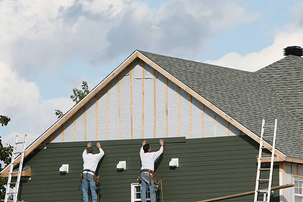 Professional Storm Damage Siding Repair technician working in Penfield, PA